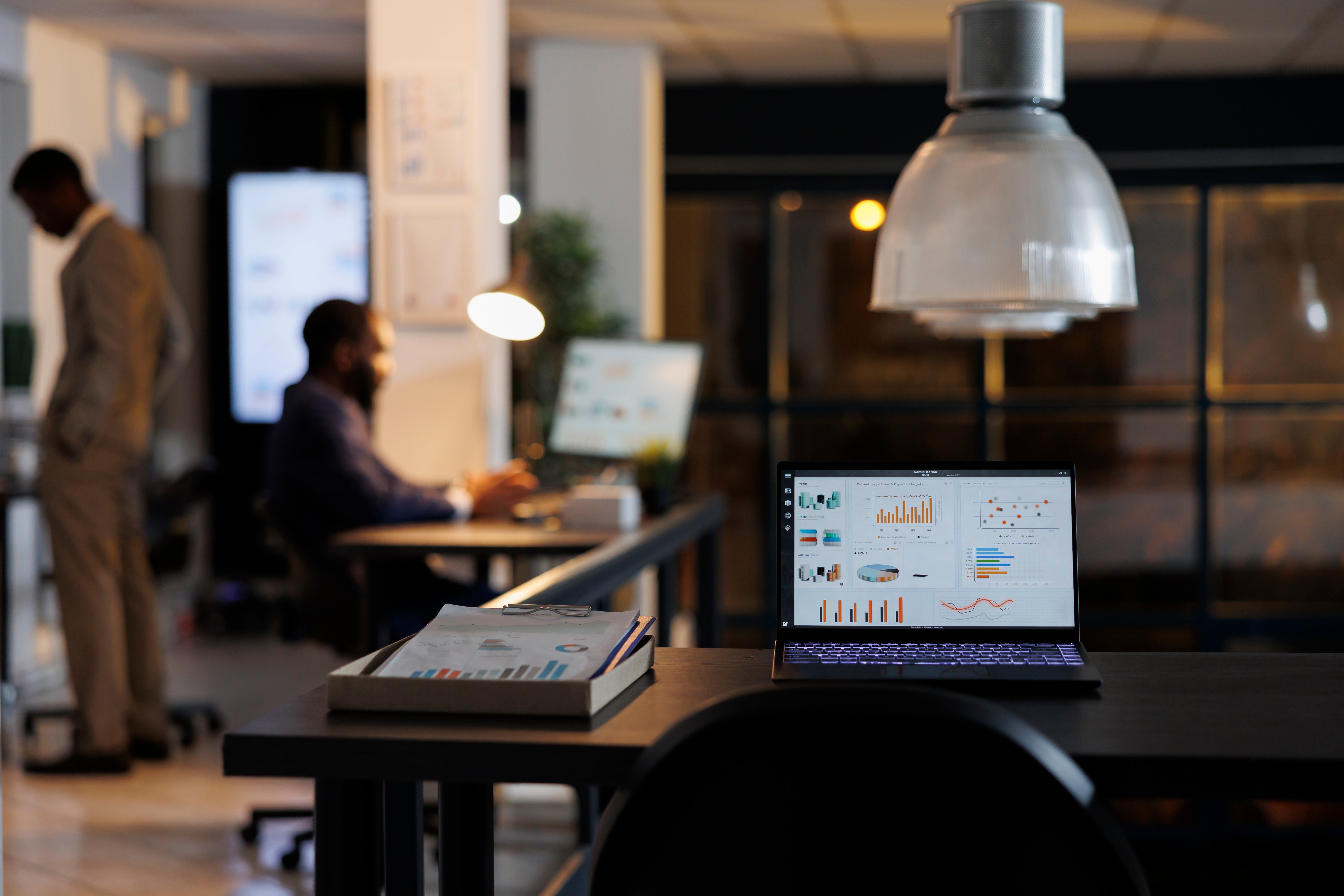 laptop-computer-with-marketing-statistics-standing-desk
